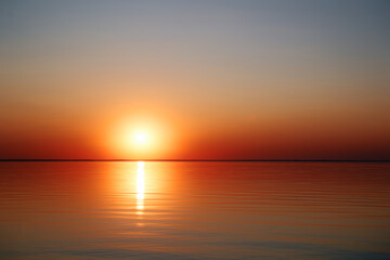 Beautuful sunset on the sea with sun reflecting in water