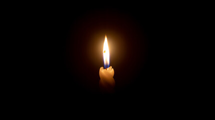 A single burning candle flame or light glowing on a white spiral candle on black or dark background...