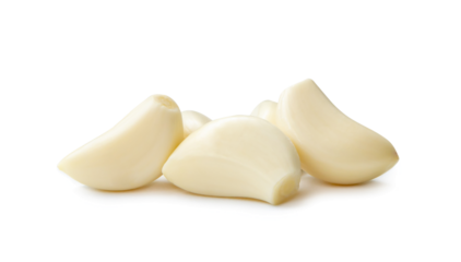Peeled garlic cloves in stack isolated on white background with clipping path and shadow in png file format