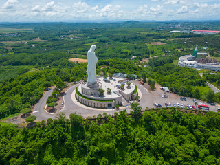 Aerial view of Our lady of Lourdes Virgin Mary catholic religious statue on a Nui Cui mountain in Dong Nai province, Vietnam.