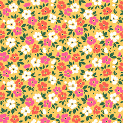 Abstract floral background. Floral pattern with small bright colors flowers on a yellow background. Seamless pattern for design and fashion textile prints. Ditsy style. Stock vector illustration.