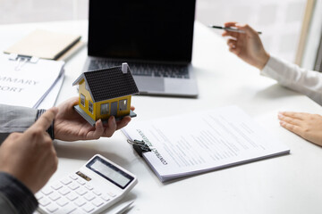 Businessmen, real estate agents discuss house purchase prices, fee, mortgage, interest, rent, cash flow, loan. Negotiate for businessmen to legally sign home purchase agreements contract , lease.