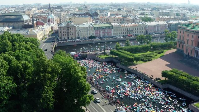 St. Petersburg, summer 2022: Paddle boarding festival Fontanka SUP, world largest SUP carnaval, panoramic drone view
