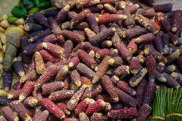 Dark purple color corn for sale in the food market.