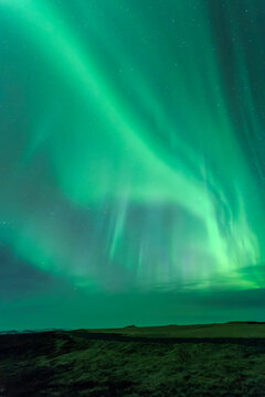 Aurora borealis over field