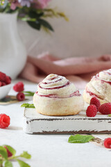 Homemade buns with raspberry. Season's dessert.