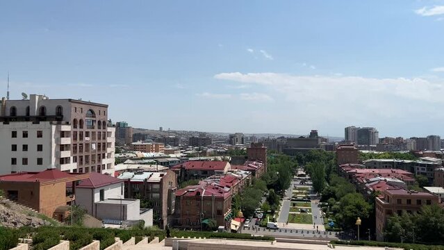 Horizontal 4K video. Panorama overlooking the city landscape. Armenian city of Yerevan from height of mountain. Roof of house, street, trees. Urban cityscape. Concept of tourism, travel, vacation