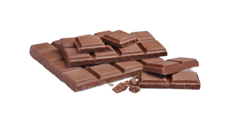 Pieces of delicious milk chocolate bars on white background