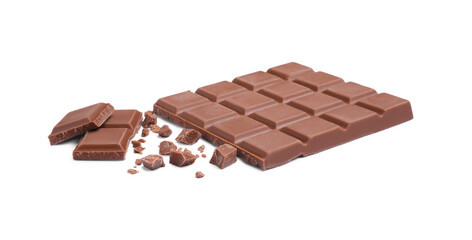 Pieces of delicious milk chocolate bar on white background