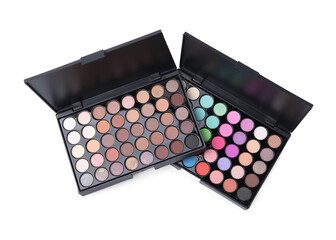Beautiful eye shadow palettes isolated on white, top view