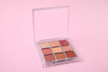 Beautiful eye shadow palette on pink background