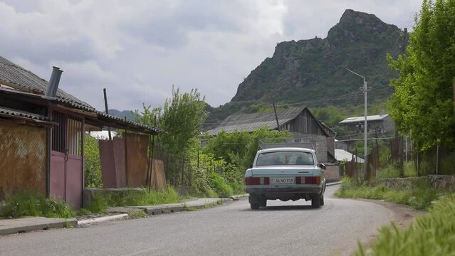 cars drive on a country road