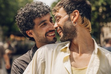 couple walking kissing and huging in the city
