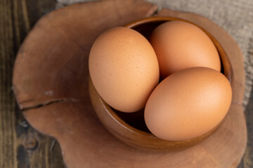 A clean whole orange chicken egg close-up on the table