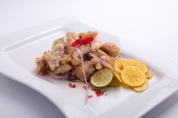 chicharon breaded fried fish and corn, aji with symbol dish of Peruvian cuisine. Peru.