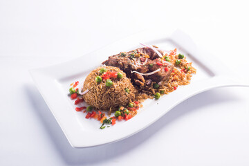 ARROZ CON PATO, RICE WITH DUCK, PERUVIAN GASTRONOMY DISH 
