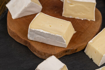 delicious sliced cheese with edible white mold