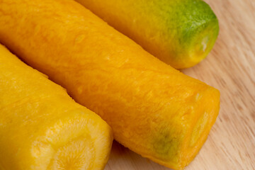 Sliced bright yellow carrots on the table