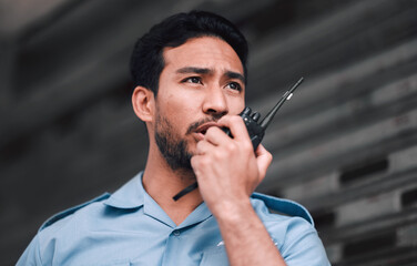 Walkie talkie, security guard or safety officer man outdoor for protection, patrol or watch. Law enforcement, transceiver and duty with a crime prevention male worker in uniform with communication