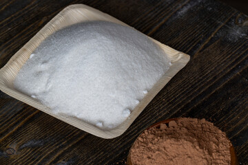 White sugar poured into a bowl