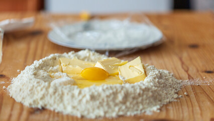 flour and eggs on table, ingredients for baking an Italian crostata