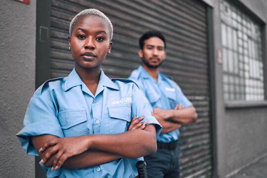 Portrait of black woman, security guard or arms crossed of safety officer, protection service or team patrol in city. Law enforcement, focus or professional crime prevention people in uniform outdoor