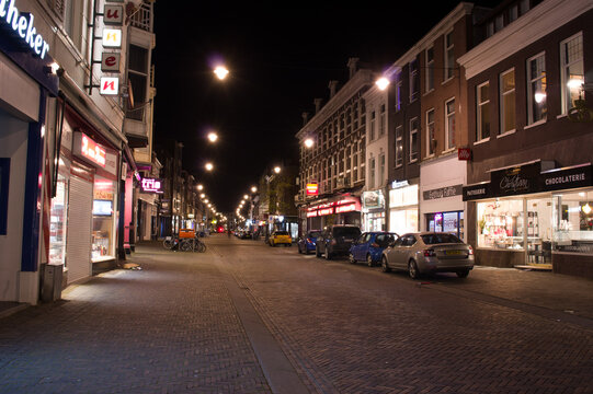 Arnhem, Netherlands - February 12, 2020: Steenstraat in Arnhem at night. The Steenstraat is a shopping street near the center of Arnhem