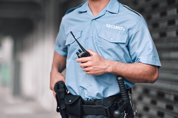 Security guard, safety officer and man with walkie talkie in hand on street for protection, patrol...