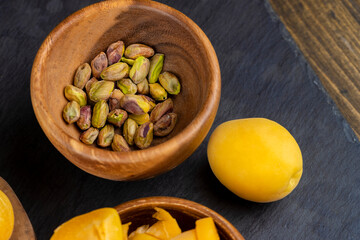ripe yellow apricots on the table close-up