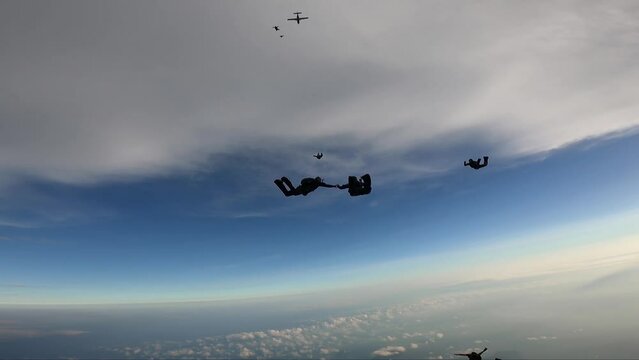 Skydiving team work above above the port of Santos
