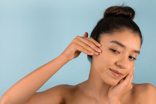 Ethnic woman touching face