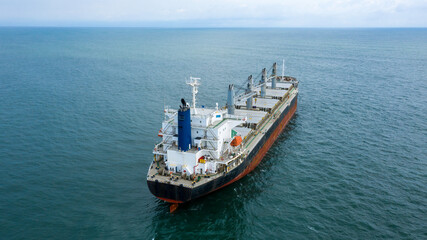 Self-unloading bulk carrier at Rio De La Plata anchorage. Aerial stern view.