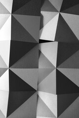 Geometric shapes made gray paper, abstract background.