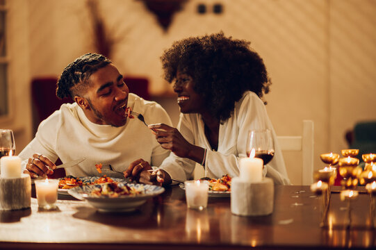 African american couple having romantic dinner date at home