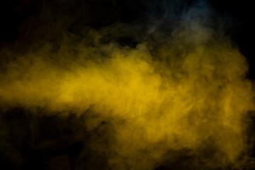 Yellow steam on a black background.