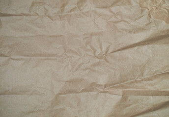 Brown wrapping paper texture, crumpled clean sheet. Craft crumpled paper, cardboard background.