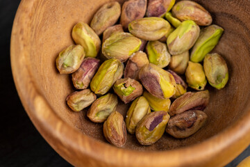a large number of salty and crispy pistachios close-up