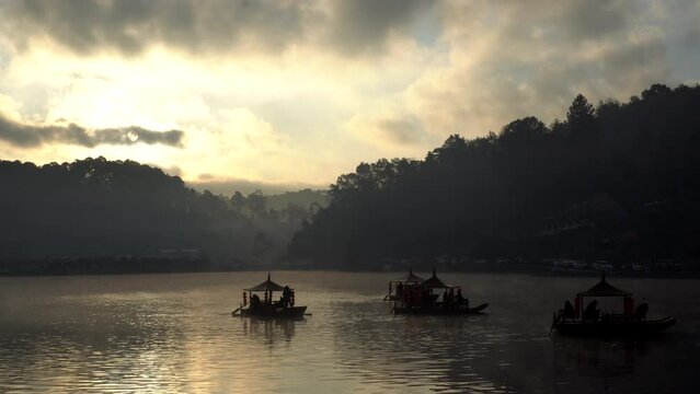 ban ruk thai Yunnan village of Thailand, mae hong son province chinese boat in morning golden sunrise lake with fog