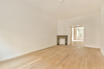 Fototapeta na wymiar an empty living room with wood flooring and white walls in the room is very clean, but there is no furniture