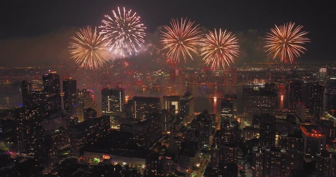 Awesome Aerial Video of NYC's 4th of July Fireworks Light up the Night sky over tall dark buildings Manhattan Queens Brooklyn