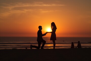 Silhouette of a couple in love in which the man asks the woman on his knees to marry him during a beautiful sunset on the beach. Concept of marriage proposal.