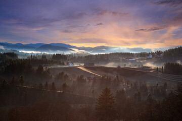 Foggy sunset in the village Bratsberg, Norway