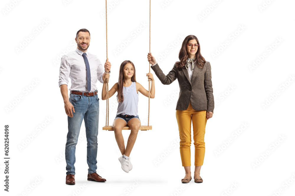 Wall mural mother and father standing next to their kid on a swing