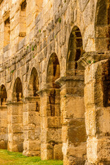 ancient wall with arches and windows of historical building, ancient architecture outdoor , roman arena in Pula