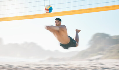 Volleyball, diving and man jump at beach in air for fun competition, contest and motion blur. Male...