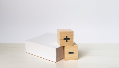 plus minus with wooden cube documents