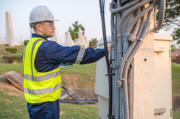 Telecommunication engineers work at cell towers for 5G cell phone signals,Network tower maintenance...