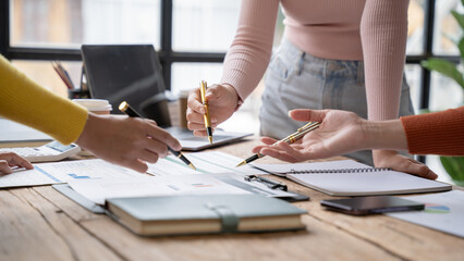 Financial analyst analyzes businessman investment consultant analyzing company financial report balance sheet statement working with documents graphs. Concept picture for stock market, office, tax