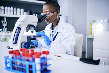 Science, laboratory and woman on microscope for blood test research, medical analysis and dna or...