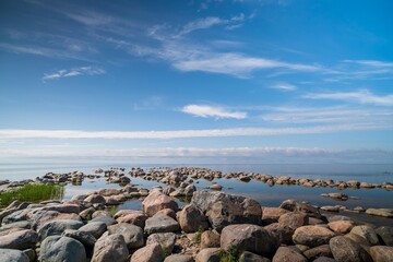 The rocky shore of the Baltic Sea. Beautiful sunny summer day, calm sea. Baltic Sea Estonia Kihnu...